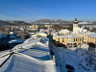 view of the town square of Frenstat pod Radhostem in winter