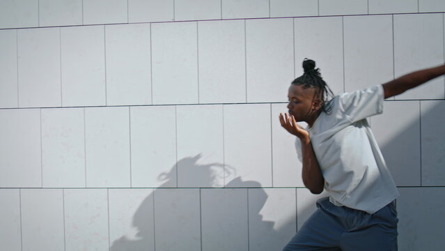 Plastic man rehearsing dance at street closeup. Dancer doing sensual moves