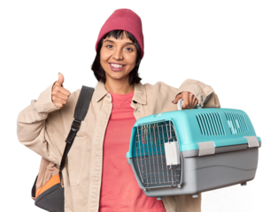 Young Hispanic woman ready for travel with pet carrier smiling and raising thumb up