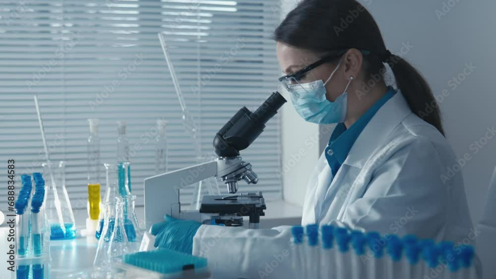 Poster The investigator performs routine analyses, ensuring the stability and reliability of results in medical studies and chemical analyses. Woman worker doing laboratory work with microscope