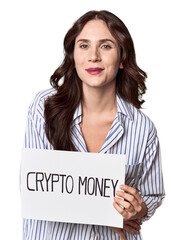 Young Caucasian woman holding 'crypto money' sign laughing and having fun.