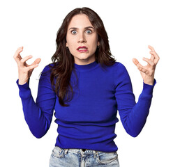 Young Caucasian woman in a studio setting screaming with rage.