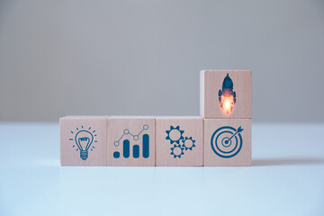 Startup Business Ideas, Entrepreneurs and Online Digital Business Networks on online marketing, tech. This is the beginning of a new generation of Entrepreneurs, A wooden block showing a rocket icon.