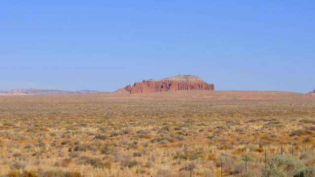 Establishing shot of mountains with red rocks in Painted Hills, Hanksville, Utah, North America. Day time on October 2023. Still camera view. ProRes 422 HQ.