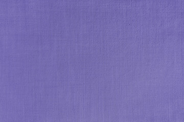 Texture background of purple linen fabric. Textile structure, cloth surface, weaving of natural cotton fabric closeup, backdrop, wallpaper.