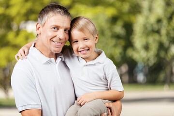 Obraz premium Playful father have fun with son in park