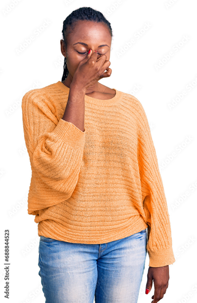 Sticker Young african american woman wearing casual clothes tired rubbing nose and eyes feeling fatigue and headache. stress and frustration concept.