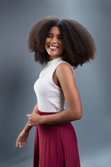 Beautiful young woman, with black power hair, standing, posing for a photo