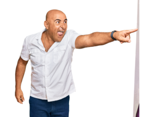 Mature middle east man with mustache wearing casual white shirt pointing with finger surprised ahead, open mouth amazed expression, something on the front