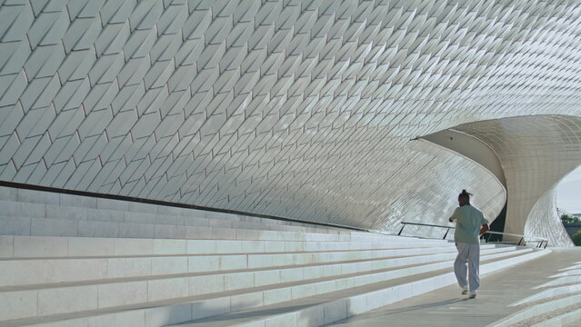 Fashion man training stairs alone. Modern dancer performing contemporary moves