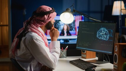 Computer operator updating artificial intelligence neural networks, writing complex binary code scripts. Outsourcing arabic freelancer in personal office uses digital device programming to upgrade AI
