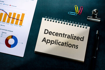 There is notebook with the word Decentralized Applications. It is as an eye-catching image.