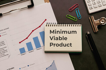 There is notebook with the word Minimum Viable Product. It is as an eye-catching image.