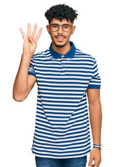 Young arab man wearing casual clothes and glasses showing and pointing up with fingers number four while smiling confident and happy.