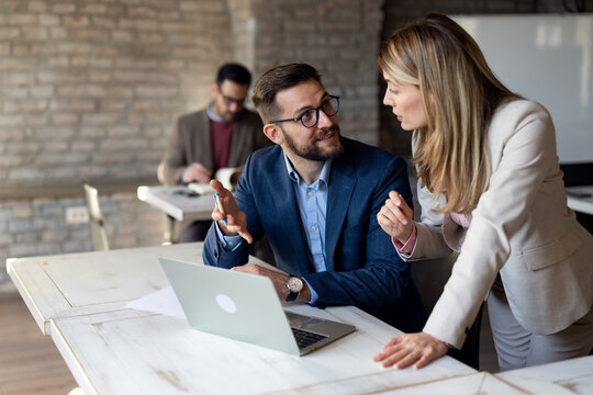 Manager gives advice to her colleague