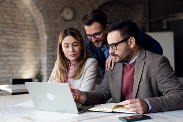 Fototapeta premium Coworkers working together at new project