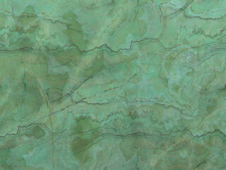 Green marble tile with natural veins. Luxury background. Abstract stone pattern.