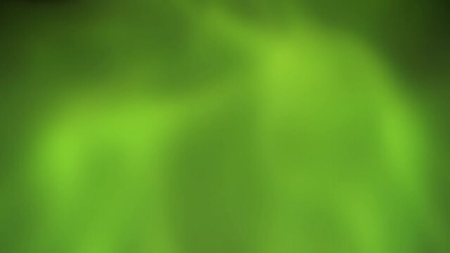 Green Radioactive Slime Goo Background 4K Loop features gooey bright green globs swirling around and intermingling in a loop.