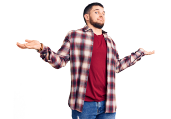 Young handsome man wearing casual shirt clueless and confused expression with arms and hands raised. doubt concept.