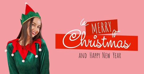 Beautiful young woman in elf's costume on pink background. Merry Christmas and Happy New Year