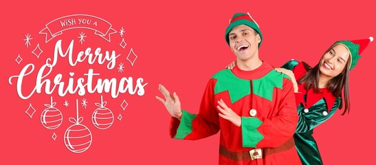 Happy couple in elf's costumes having fun on red background. Merry Christmas