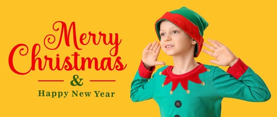 Cute little boy in elf's costume on yellow background. Merry Christmas and Happy New Year