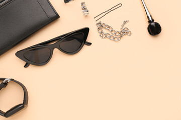 Composition with stylish sunglasses, modern smartwatch and female accessories on beige background