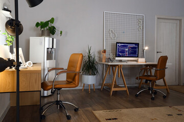 Interior of modern office with programmer's workplaces