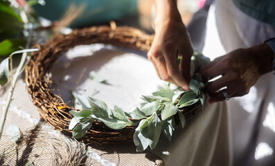 Wreath making workshop and masterclass using festive decorations.