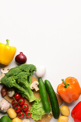 Different fresh vegetables and egg on white background