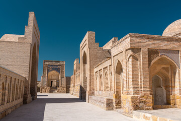 Fototapeta na wymiar Burial in the necropolis of Chor-Bakr, summer Sunny day, Bukhara, Uzbekistan.