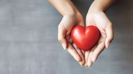 Obraz premium Holding Red Heart in Hands