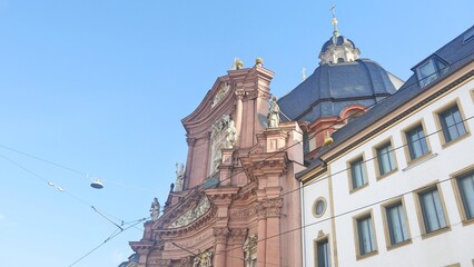 Fototapeta na wymiar Germany Wurzburg Neumünster Collegiate church has a baroque facade and dates back the 11th century 