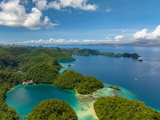 Tiktikan Lagoon and Sohoton Bay. Transparent turquoise ocean water surface. Bucas Grande Island. Mindanao, Philippines.