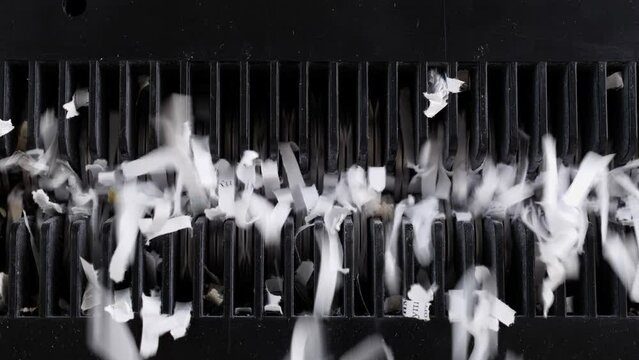 Paper Shredder Machine. Shredded secret documents. Office Cross Cut Paper Shredder