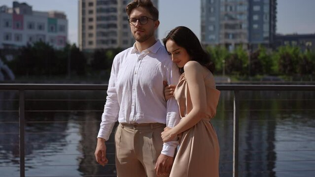 Close-up of a beautiful couple standing on a city pier