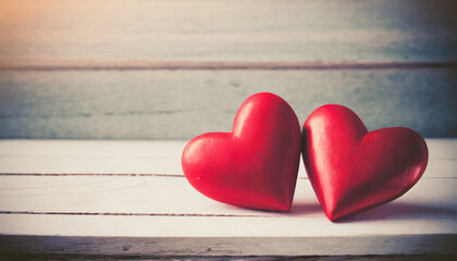 Two Red hearts over white wooden background with copy space; valentines and vintage tone photo