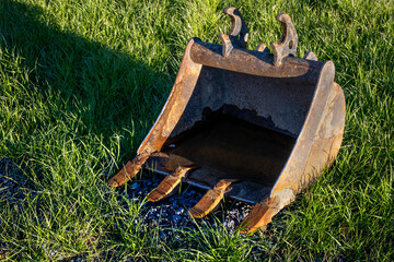 Closeup of excavator bucket scoop attachment at construction work site  © knelson20