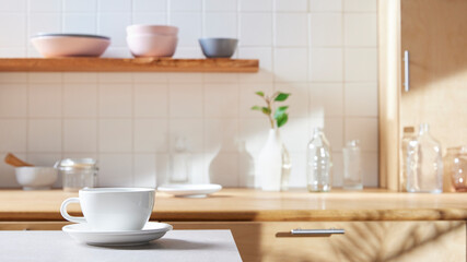 A sunny kitchen with white tile walls, a wooden table and sink.