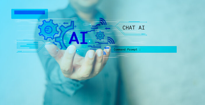 Businessman holding virtual graphic AI, Artificial Intelligence using command prompt for generating something, Futuristic technology transformation. Chat with AI