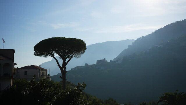 Cinematic view of famous Amalfi Coast with Gulf of Salerno from Villa Cimbrone Gardens in Ravello, Campania, Italy, summer sunny day with cloudy sky. Concept of vacations and travel in Europe