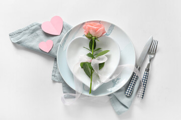 Beautiful table setting with rose for Valentine's Day on white background