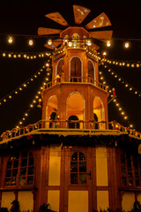 Holiday decorations of Coal Market - Targ Weglowy square in Gdansk Poland. Beautiful Christmas fair in the old town at night. Advent winter time in Europe background. Markets in December Ornamented 