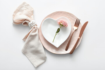 Beautiful table setting with rose for Valentine's Day on white background