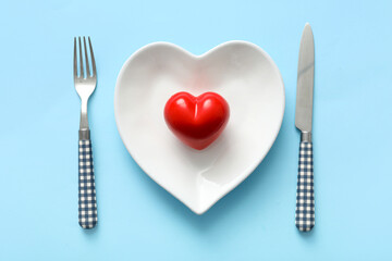 Beautiful table setting for Valentine's Day on blue background