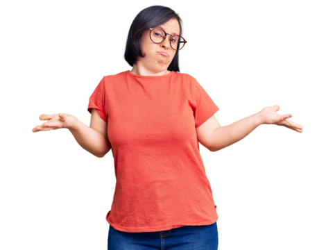 Brunette woman with down syndrome wearing casual clothes and glasses clueless and confused expression with arms and hands raised. doubt concept.