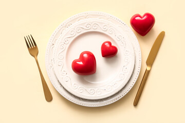 Beautiful table setting for Valentine's Day on yellow background
