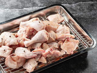Raw chicken seasoned with spices	