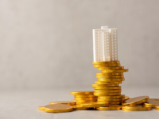 Miniature apartment on gold coin