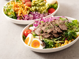 Fusilli salad, several different salads in bowls